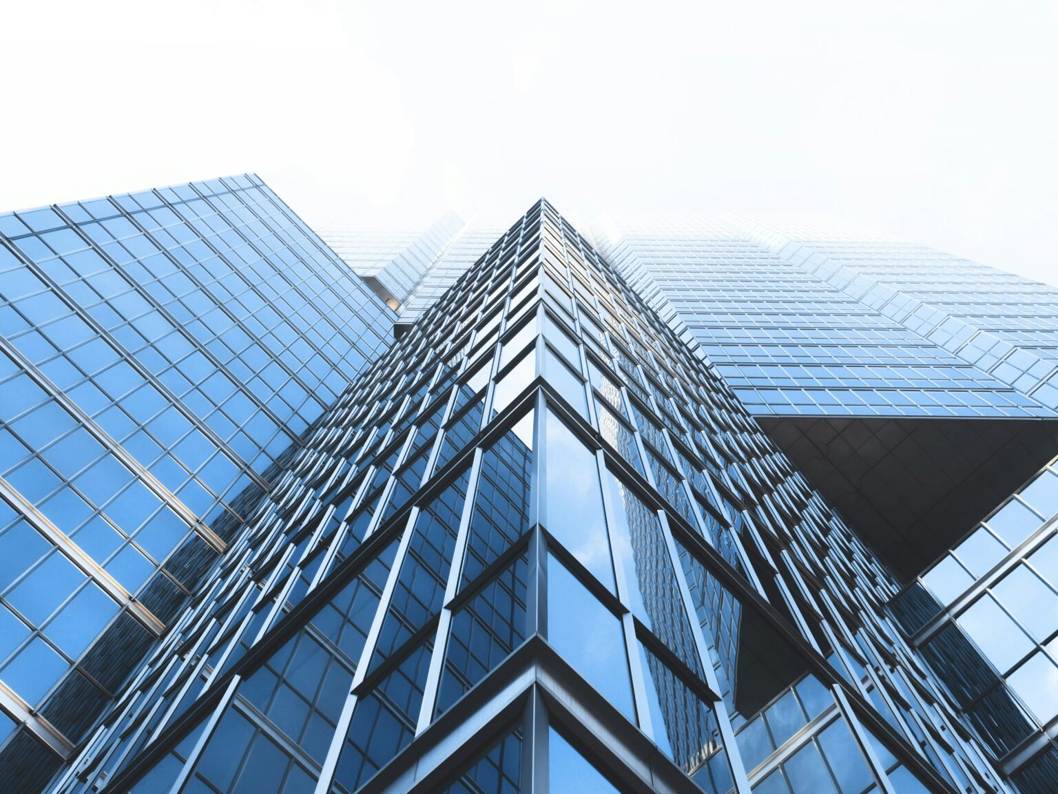 Glass office towers seen from below